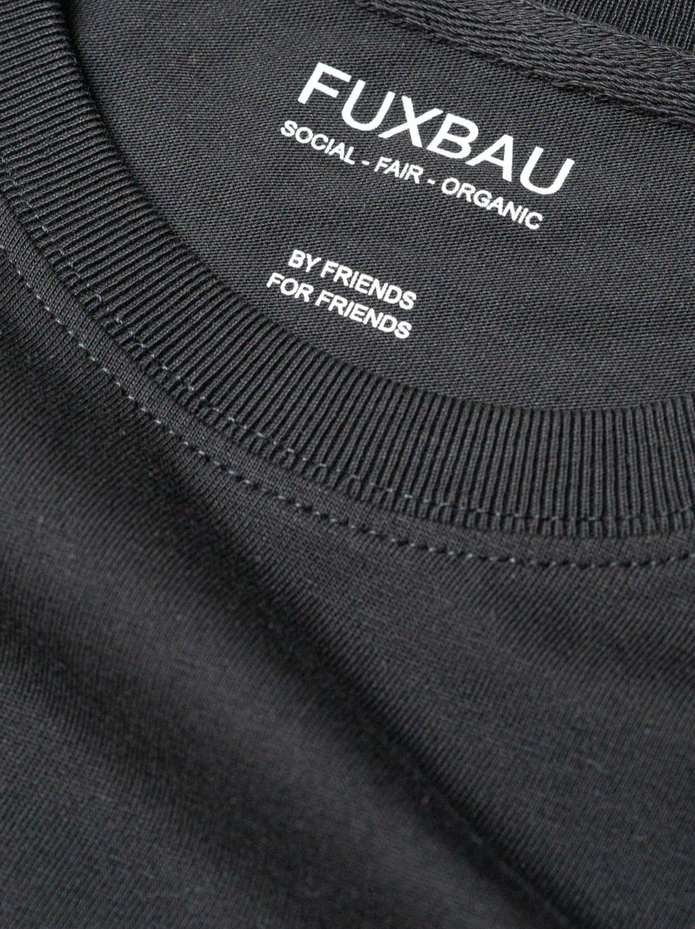 Imprint im schwarzem Basic T-Shirt FUXBAU social - fair - organic, By Friends, For Friends.