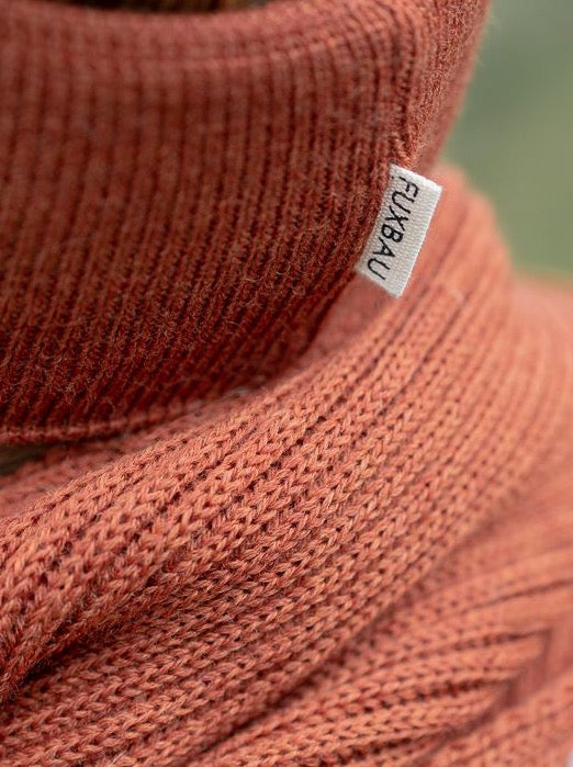 Nachhaltiges, GOTS zertifiziertes Stirnband von FUXBAU in Herbstorange. Gefertigt unter fairen und nachhaltigen Bedingungen in Deutschland aus extra feiner und weicher Merino Schurwolle.